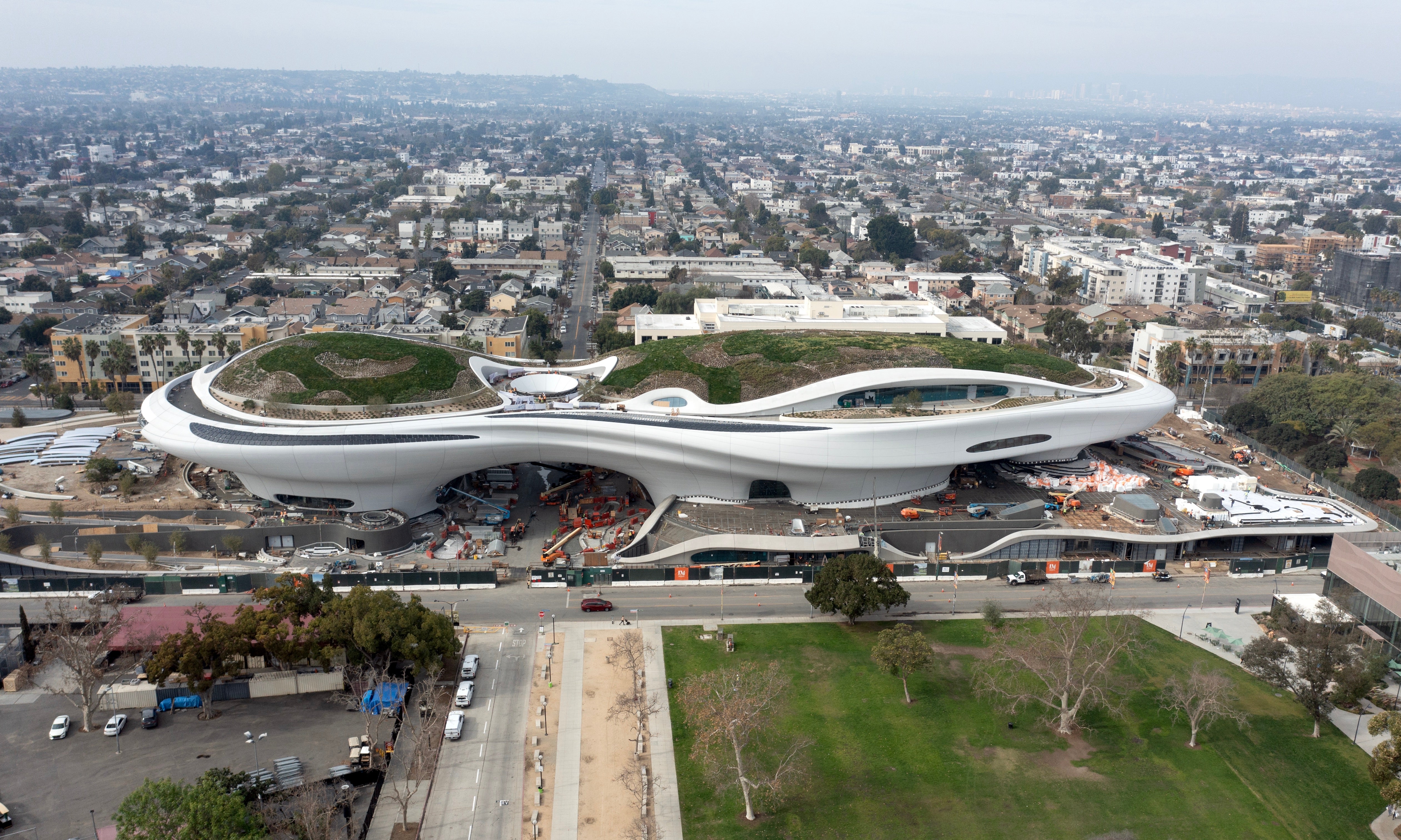 The 300,000-square-foot building sits in a landscape consisting of trees, gardens and walkways