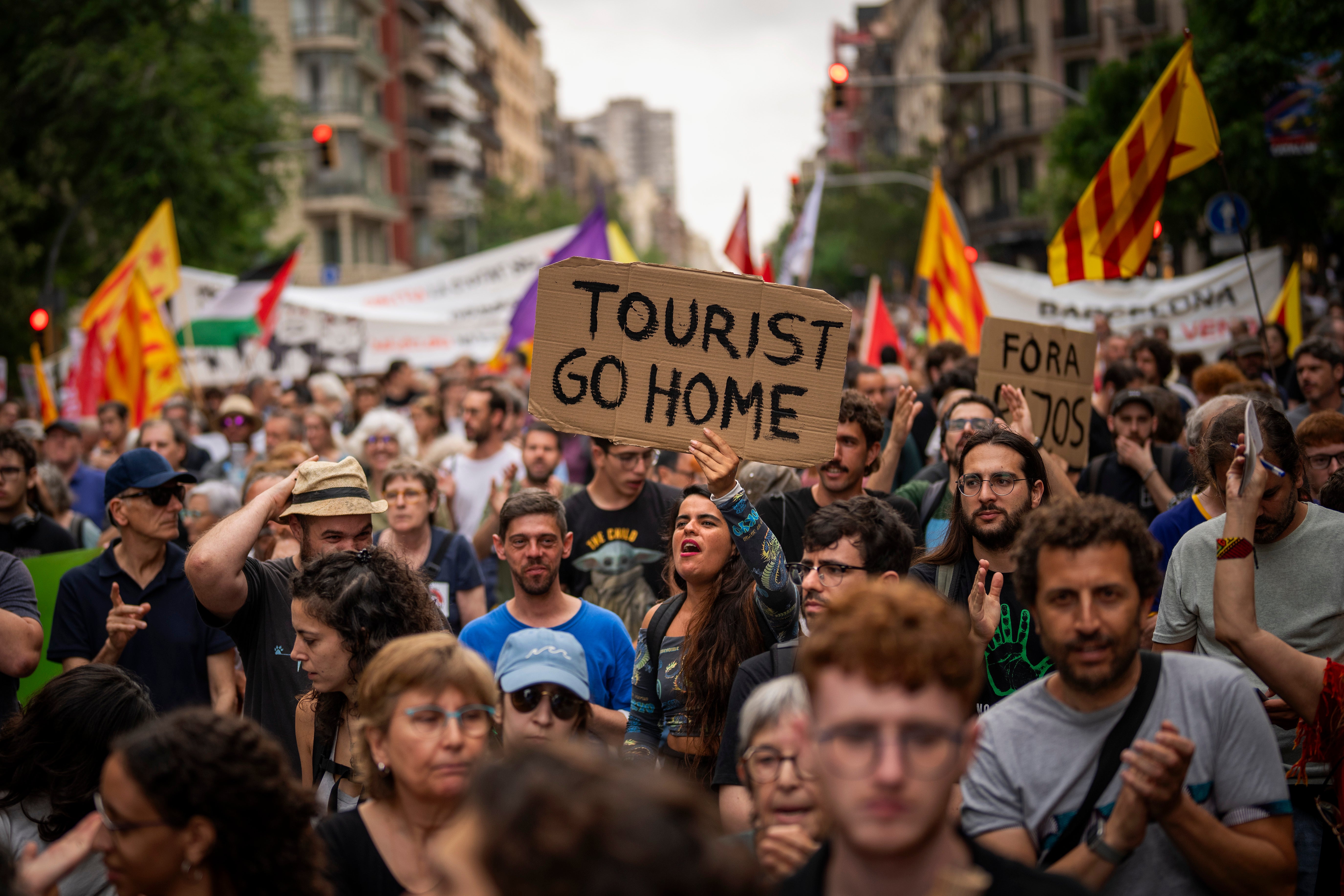 Demonstrators protest against mass tourism in Barcelona, Spain, last June