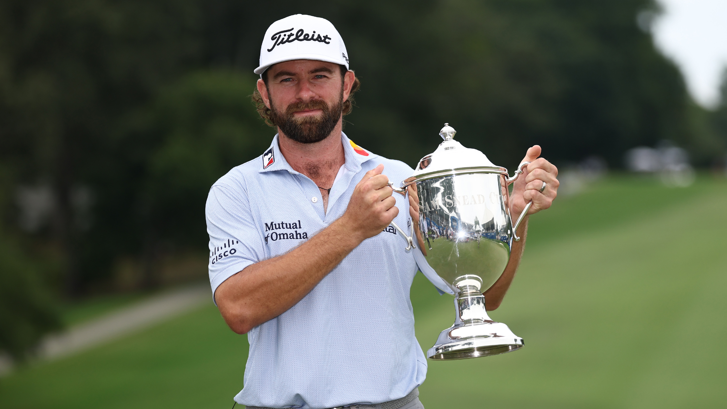 Cameron Young with the Wyndham Championship trophy